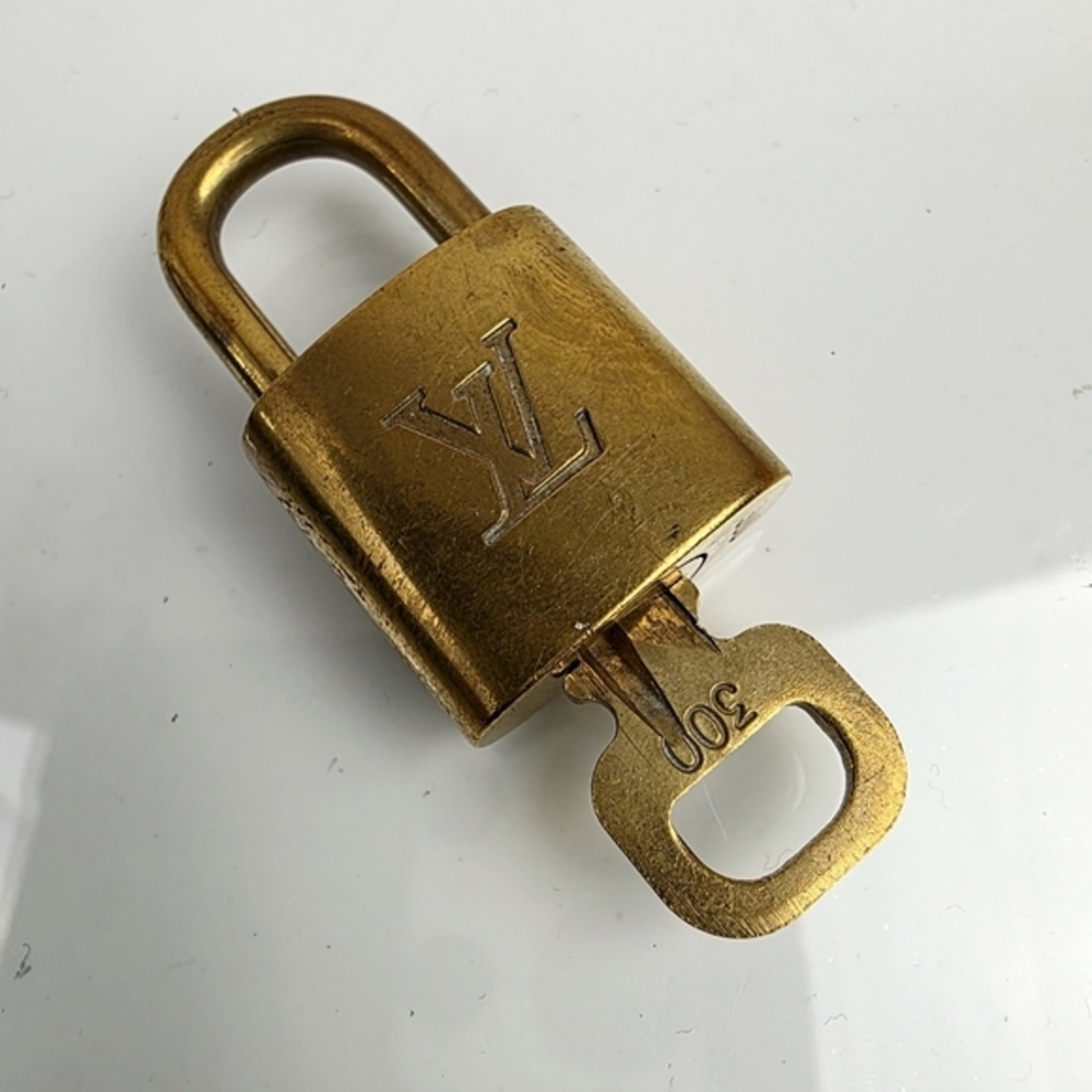 # 300 Louis‎ Vuitton Gold Padlock with Key